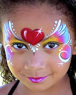 Young girl with her face painted in bright colors
