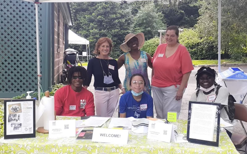 Students at a Juneteenth information booth